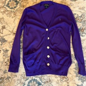 Purple cardigan with white buttons
